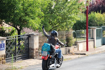 person sitting on motorcycle during daytime