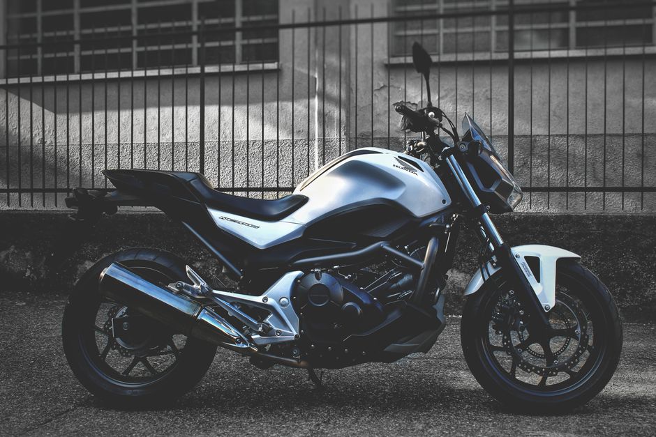 A stylish Honda motorcycle parked outdoors showcasing modern design and power.